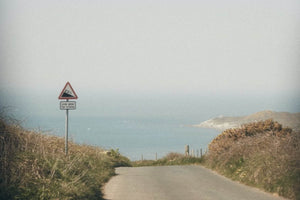 A path that leads to an open sea view.